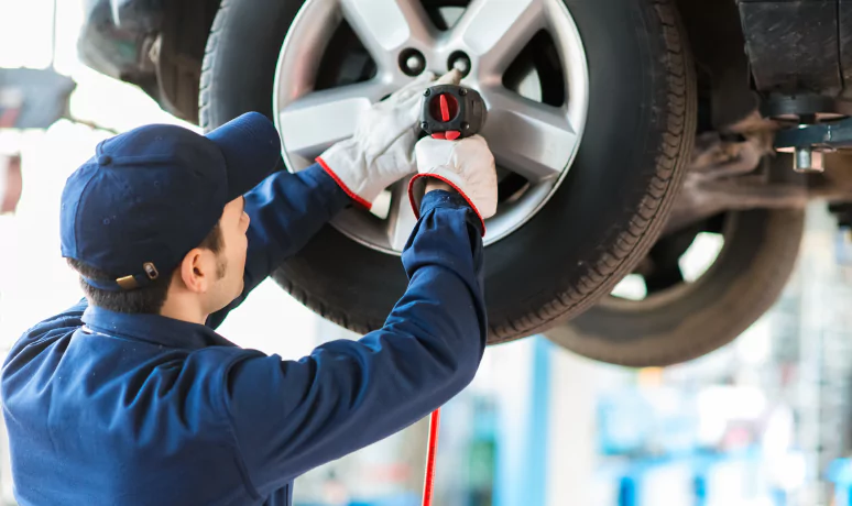 Professional mechanic smiling